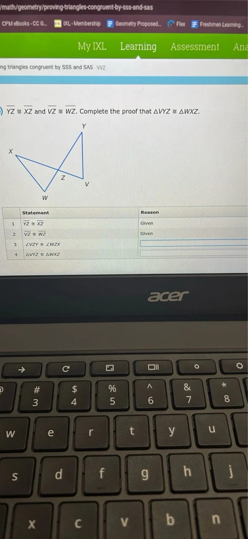 Proving triangles congruent by SSS and SAS

Y Z ≅ X Z and V Z ≅ W Z. Complete the proof that triangle V Y Z ≅ triangle W X Z.