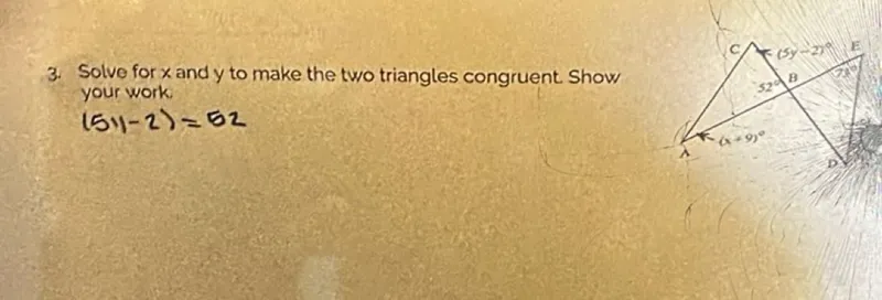 Solve for x and y to make the two triangles congruent. Show your work.