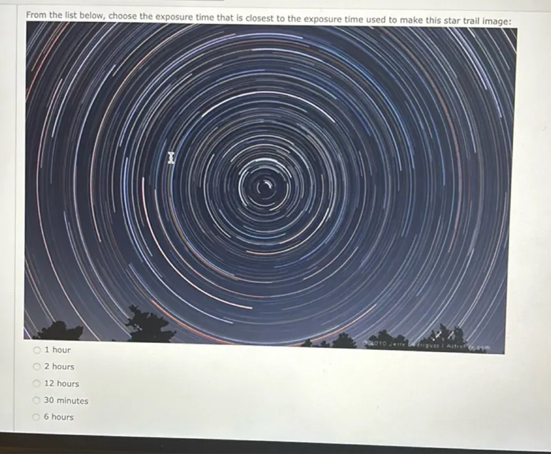 From the list below, choose the exposure time that is closest to the exposure time used to make this star trail image:
1 hour
2 hours
12 hours
30 minutes
6 hours